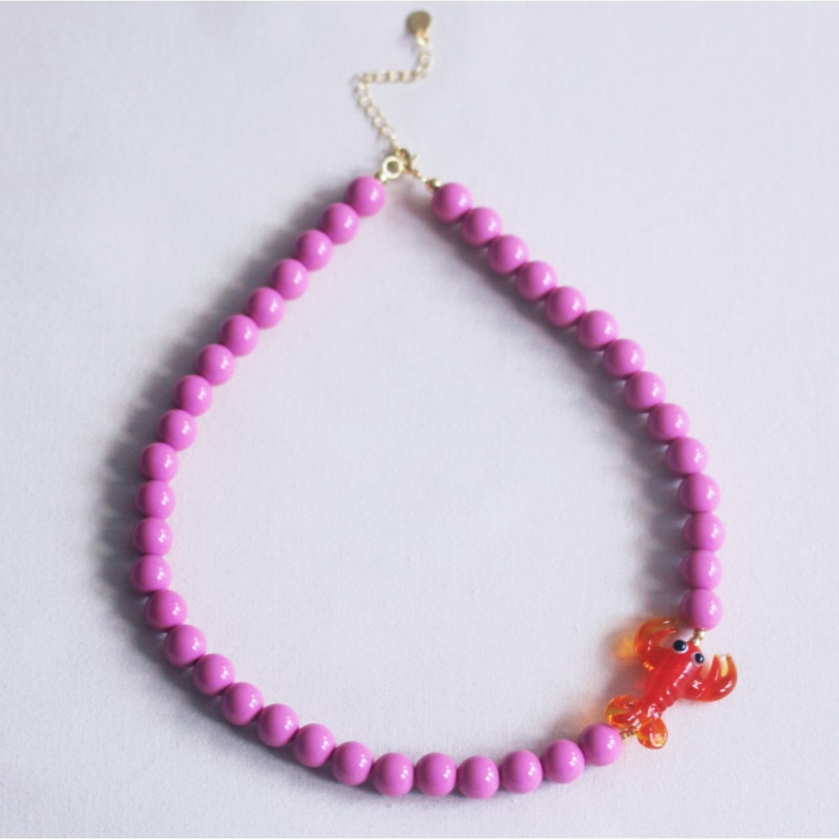 Perlenkette mit Hummer – lila