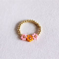 Elastischer Perlenring mit 3 Blumen – Koralle/Lachs