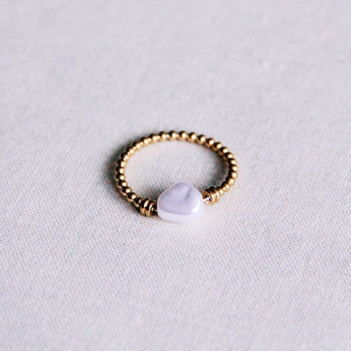 Kugelring aus Stahl mit Perle - Gold